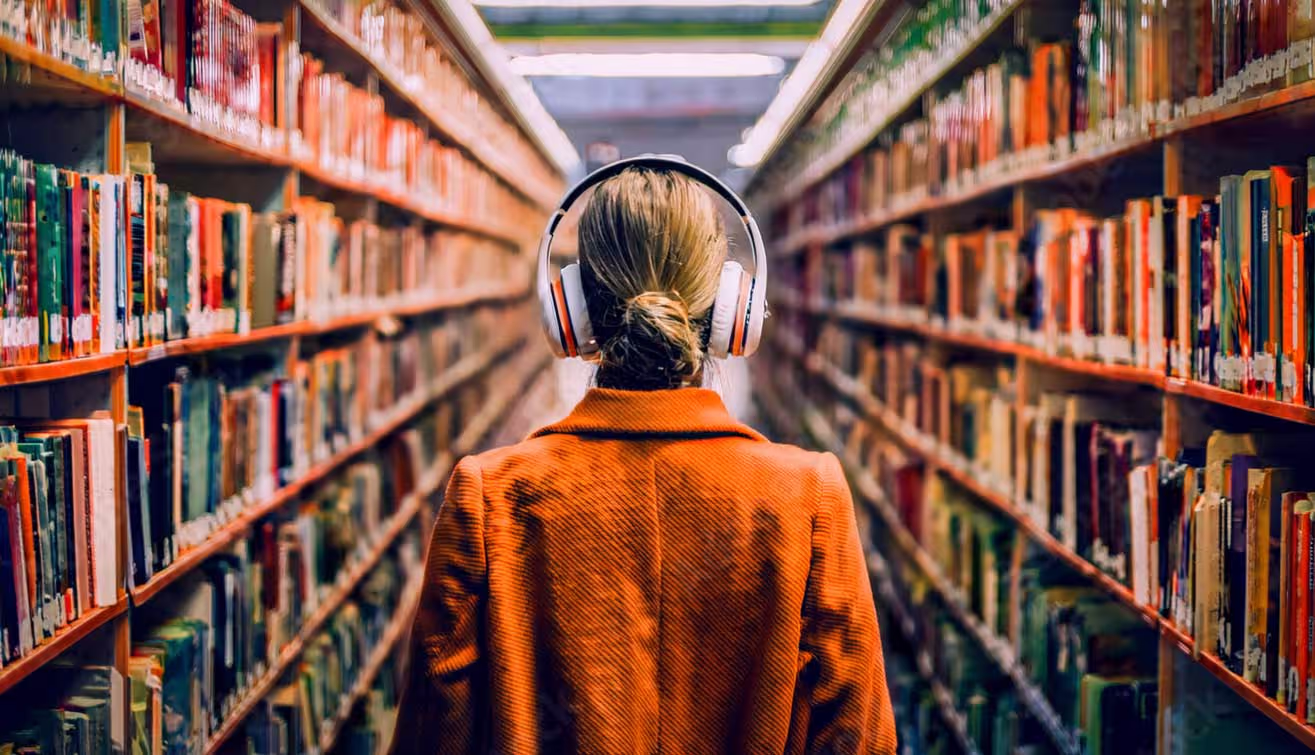 Headphones resting in a library